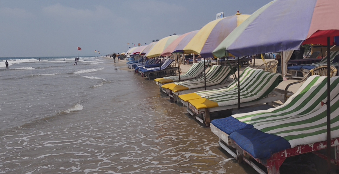 Sunbeds and beach umbrellas at Mandrem Beach Goa