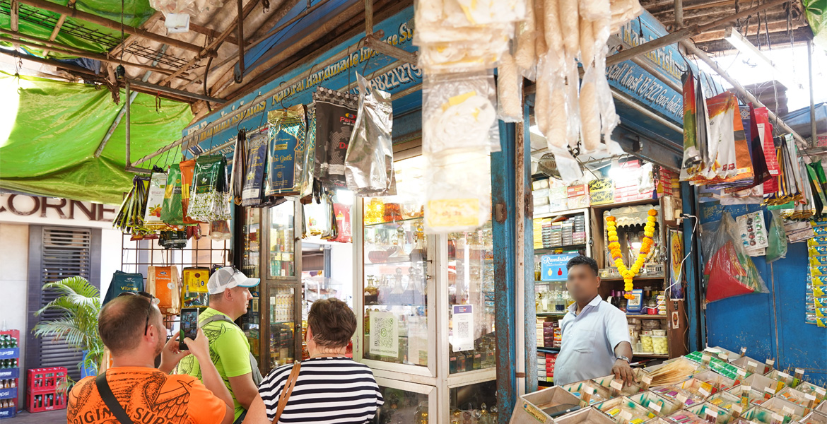 Mapusa Market Goa shop stall with local products and shoppers