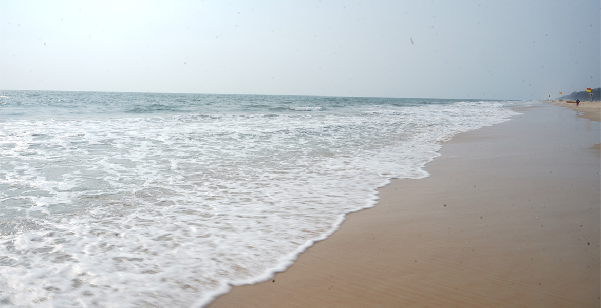 Waves on the sandy shore at Mobor Beach