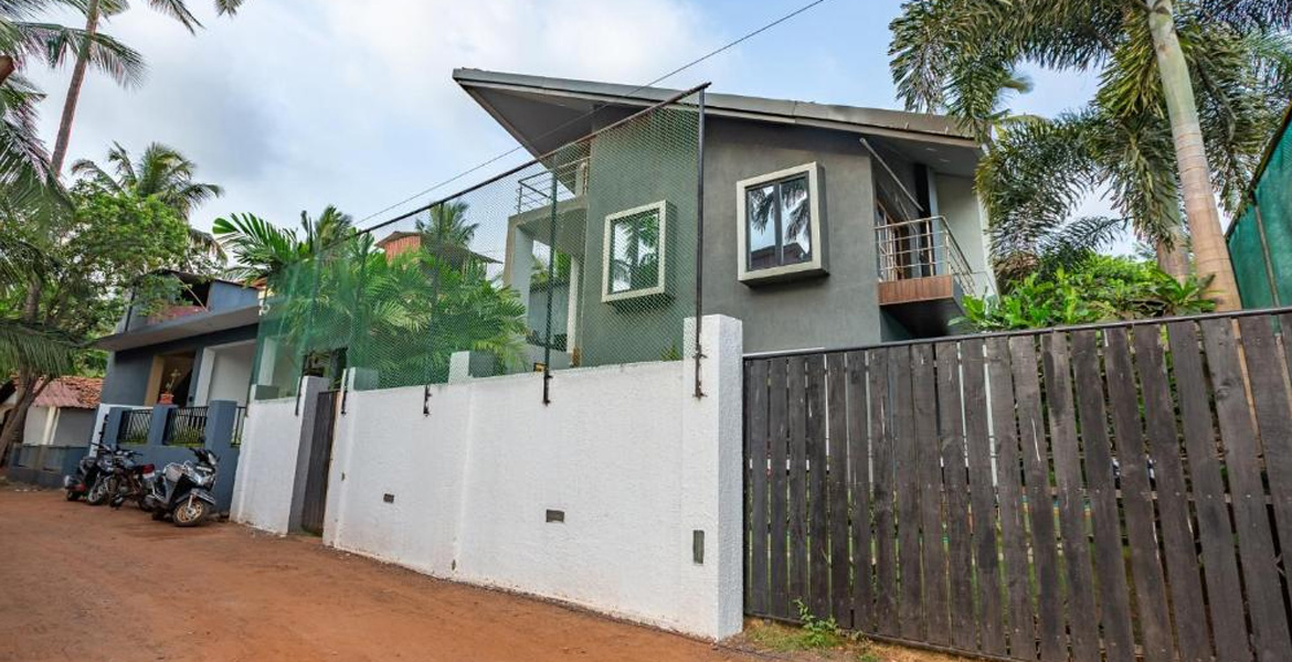Modern villa stay near lighthouse with tropical surroundings.