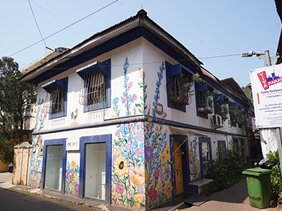 Colorful Portuguese heritage house with vibrant floral murals in Fontainhas, Panaji, Goa