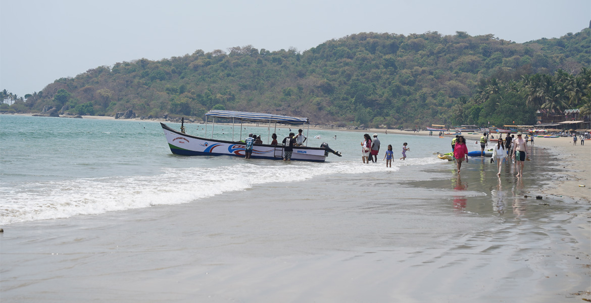 Boat and people at Palolem Beach, Goa