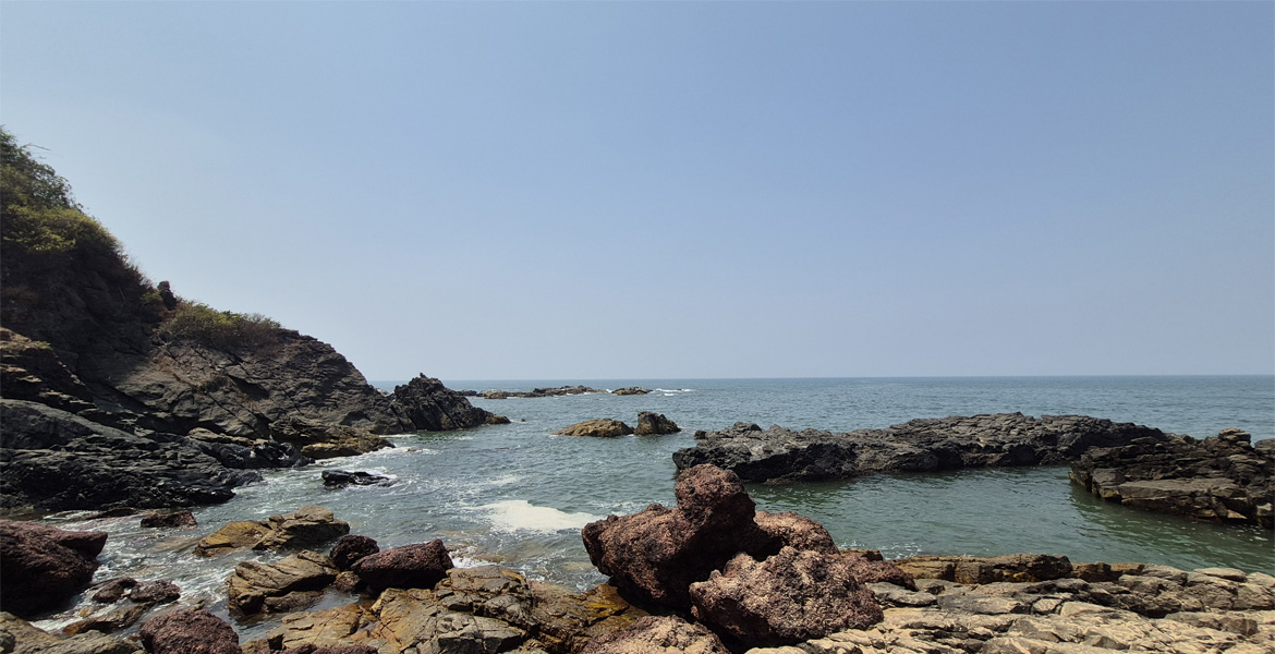 Rocky coastline at Querim Beach, Goa