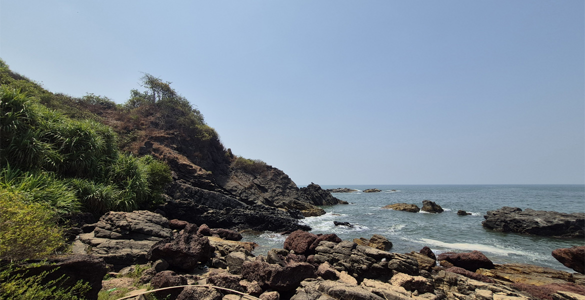 Rocky coastline at Querim Beach Goa