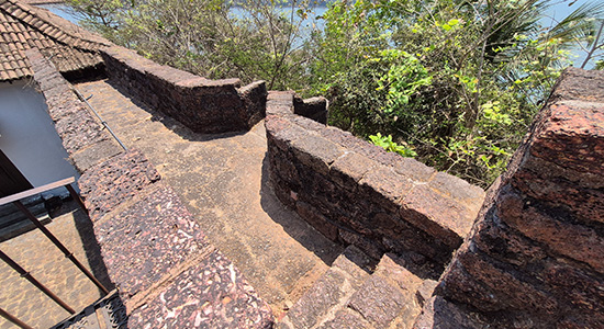 Stone passage and fort walls inside Reis Magos Fort in Goa