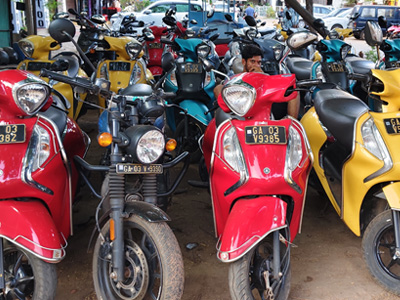 Two-wheeler rental service in Goa with scooters parked in a row