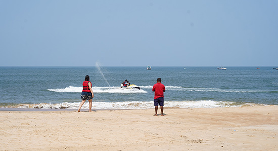 Visitors enjoying water sports at Sinquerim Beach