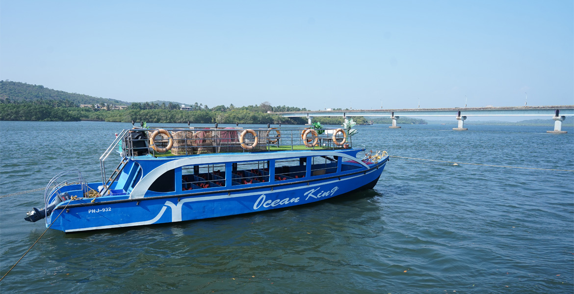 Tour boat near a bridge in Siolim, Goa