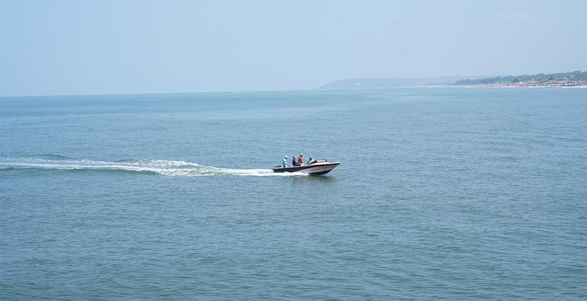 Speed boat cruising across the sea in Goa