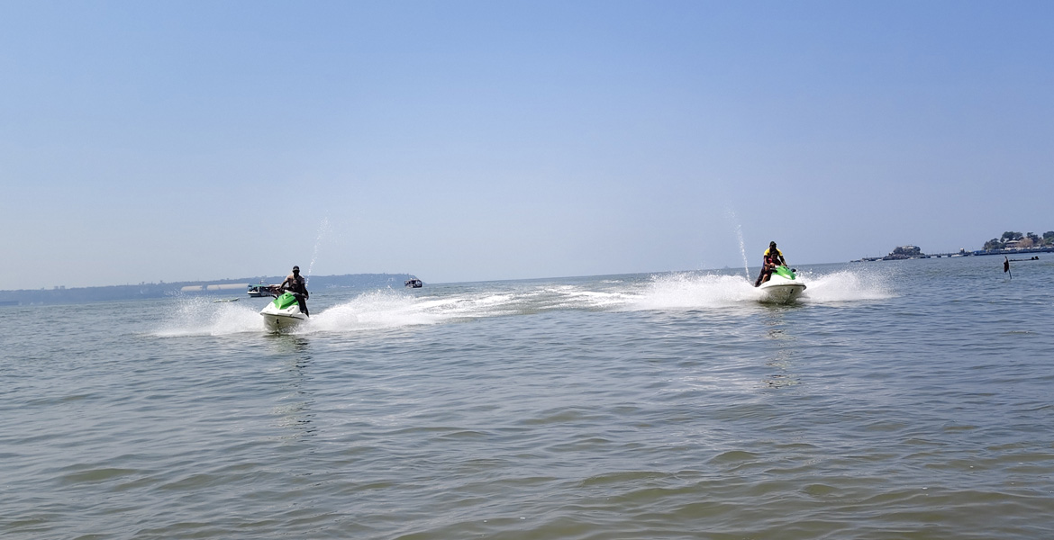 Jet ski riders speeding across the sea