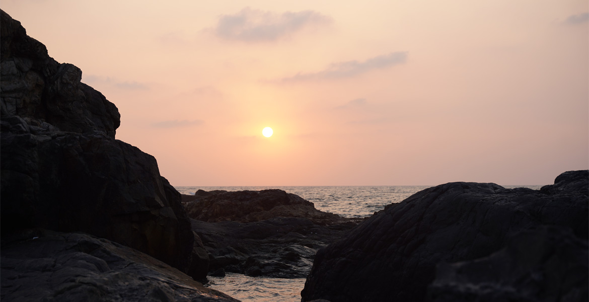 Vagator Beach Goa sunset between rocky cliffs