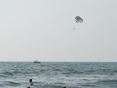 Parasailing activity over the Arabian Sea at Vagator Beach in Goa