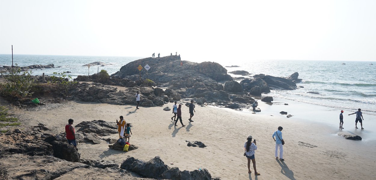 Vagator Beach with rocky shore and sea