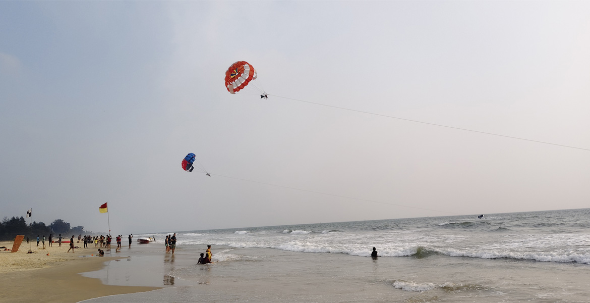 Parasailing over the sea at Varca Beach, Goa