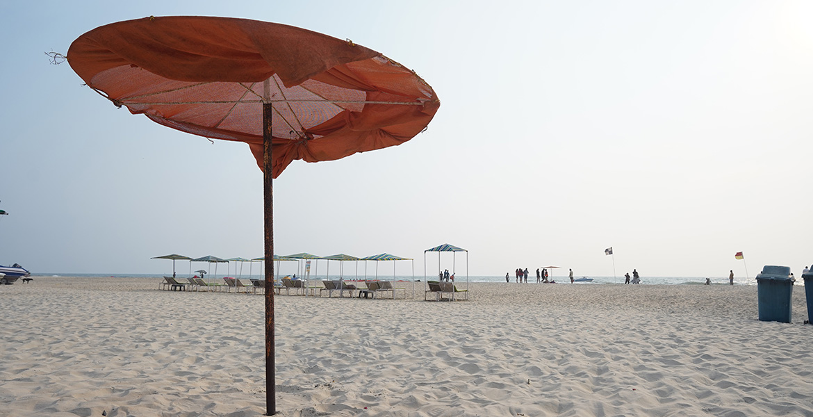Sunbeds and beach umbrellas at Varca Beach, Goa