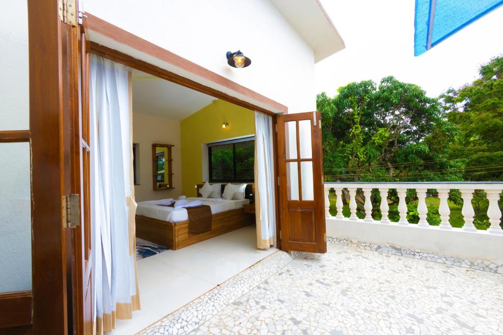 Balcony Bedroom at DE12 VILLAS ANJUNA