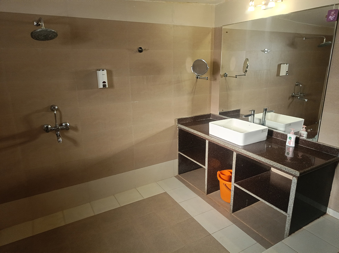 Bathroom with wide sink counter and mirror