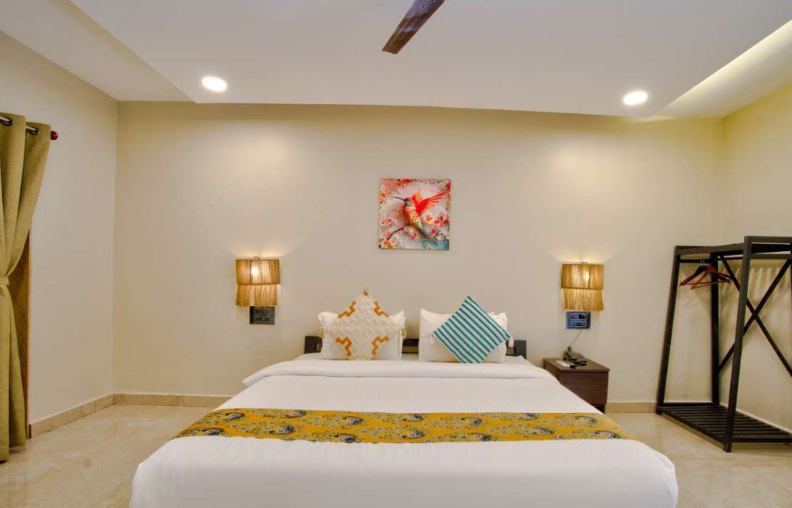 King size bedroom interior with wardrobe and side tables