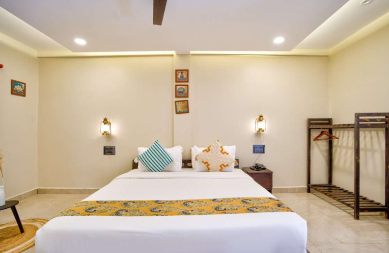 Spacious luxury villa bedroom with king bed and decor lighting