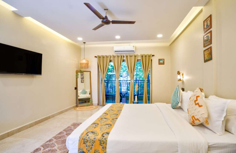 Elegant bedroom suite with wardrobe and amenities