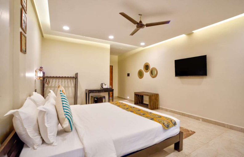 Premium bedroom suite with modern furniture and lighting