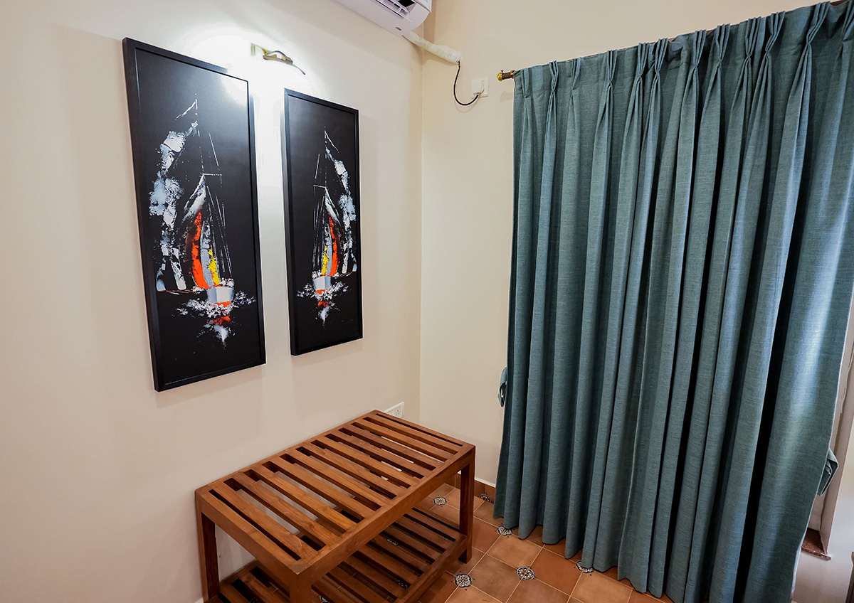 Stylish villa interior with wooden bench and abstract wall art