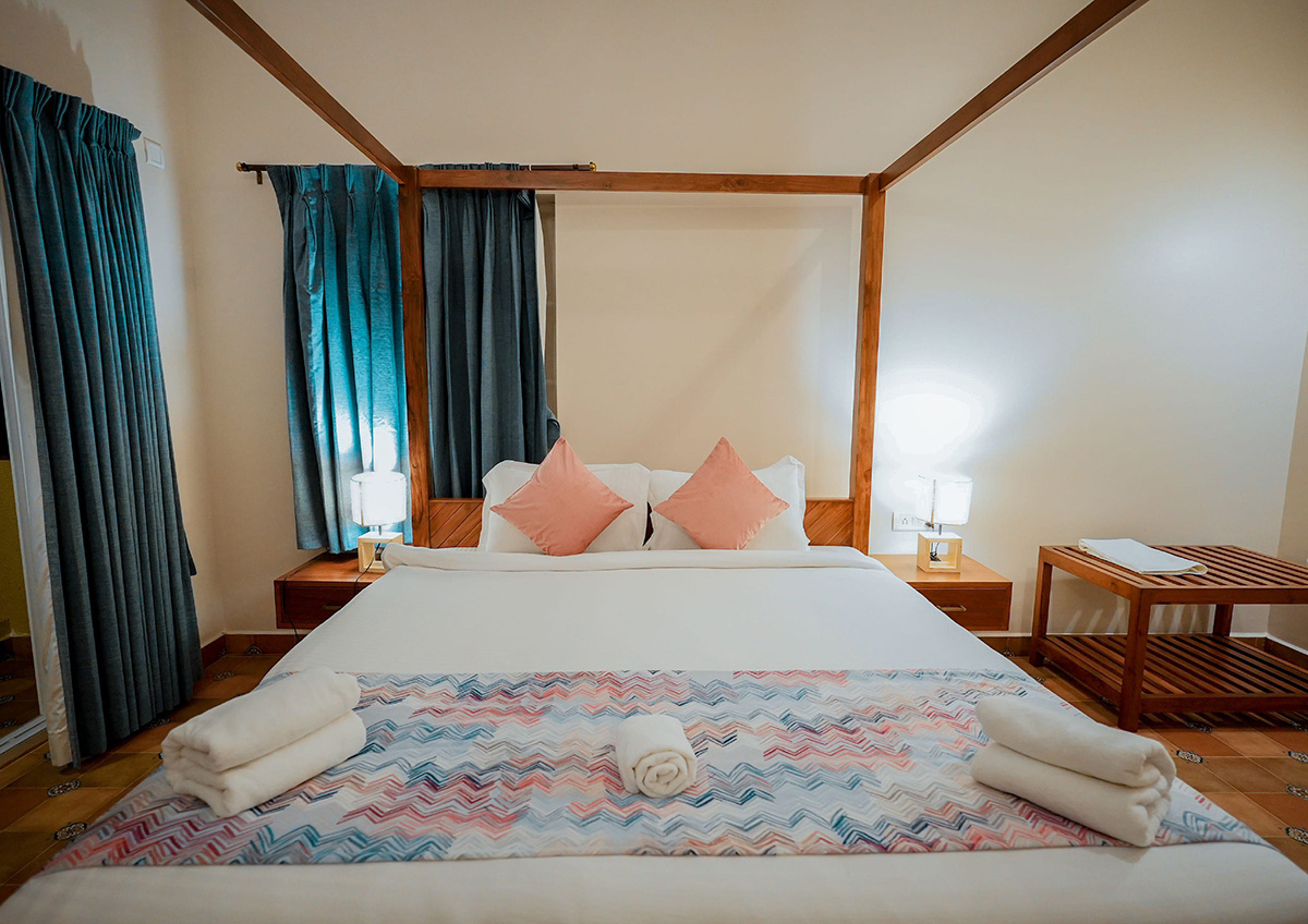 Well-appointed bedroom showcasing comfortable bedding and bedside lamps