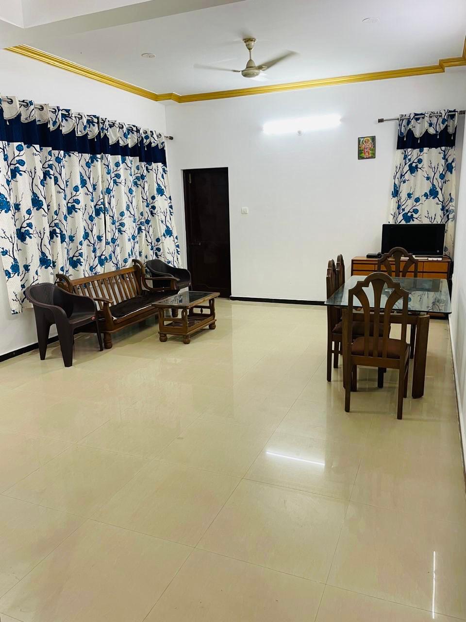 Living and dining area with wooden furniture