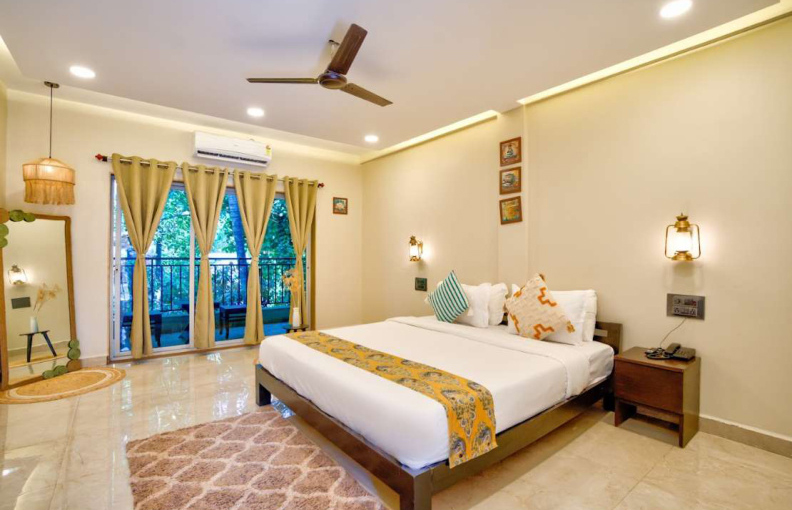 Spacious bedroom with balcony and seating area