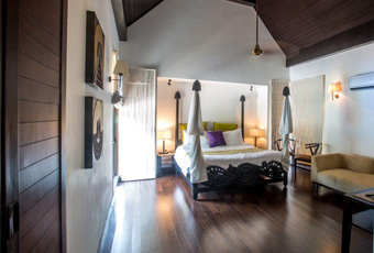 Elegant honeymoon villa bedroom with canopy bed